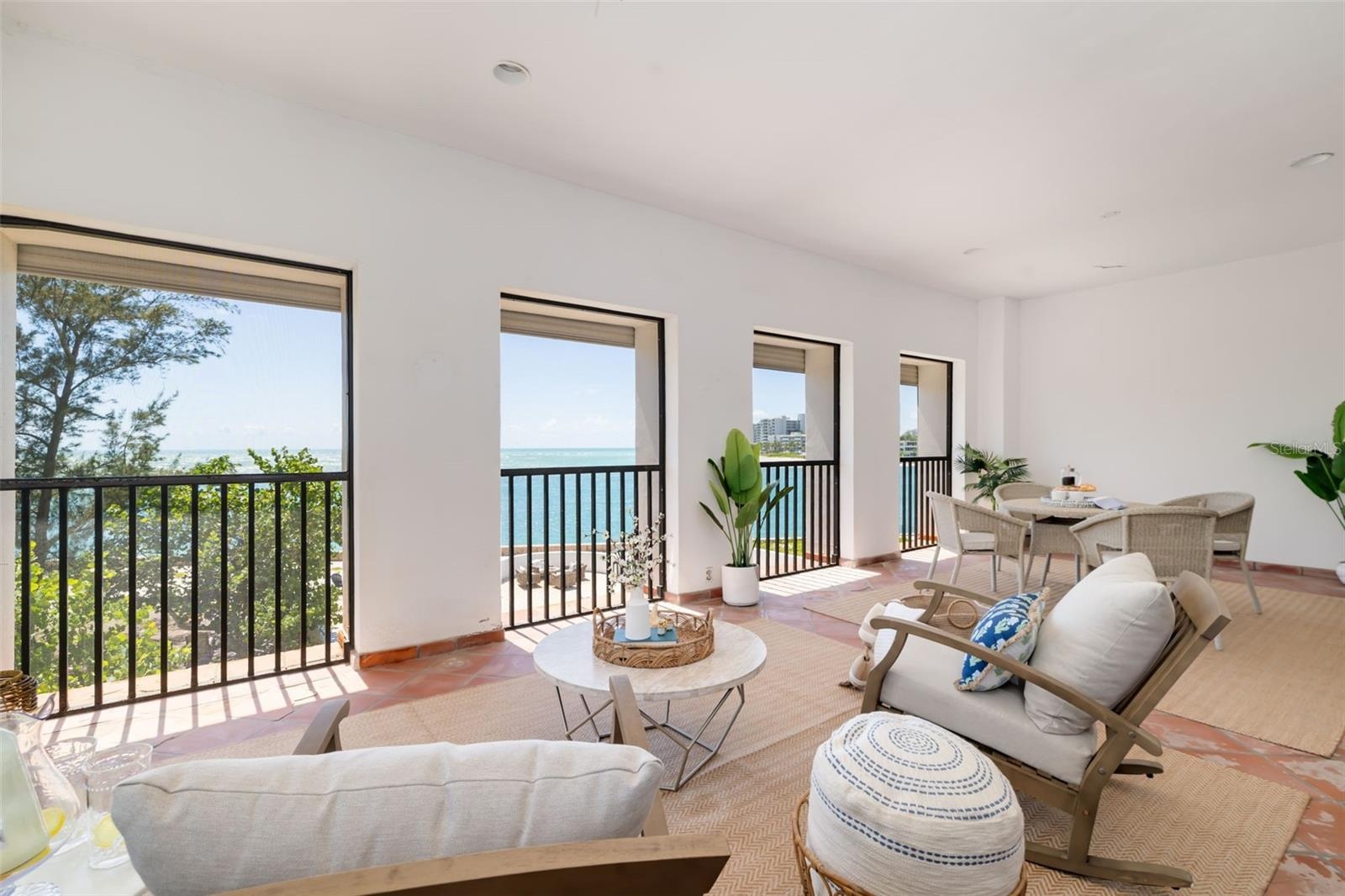 The screened and covered terrace off the Primary bedroom with views that go on and on....   The breeze is amazing up here...