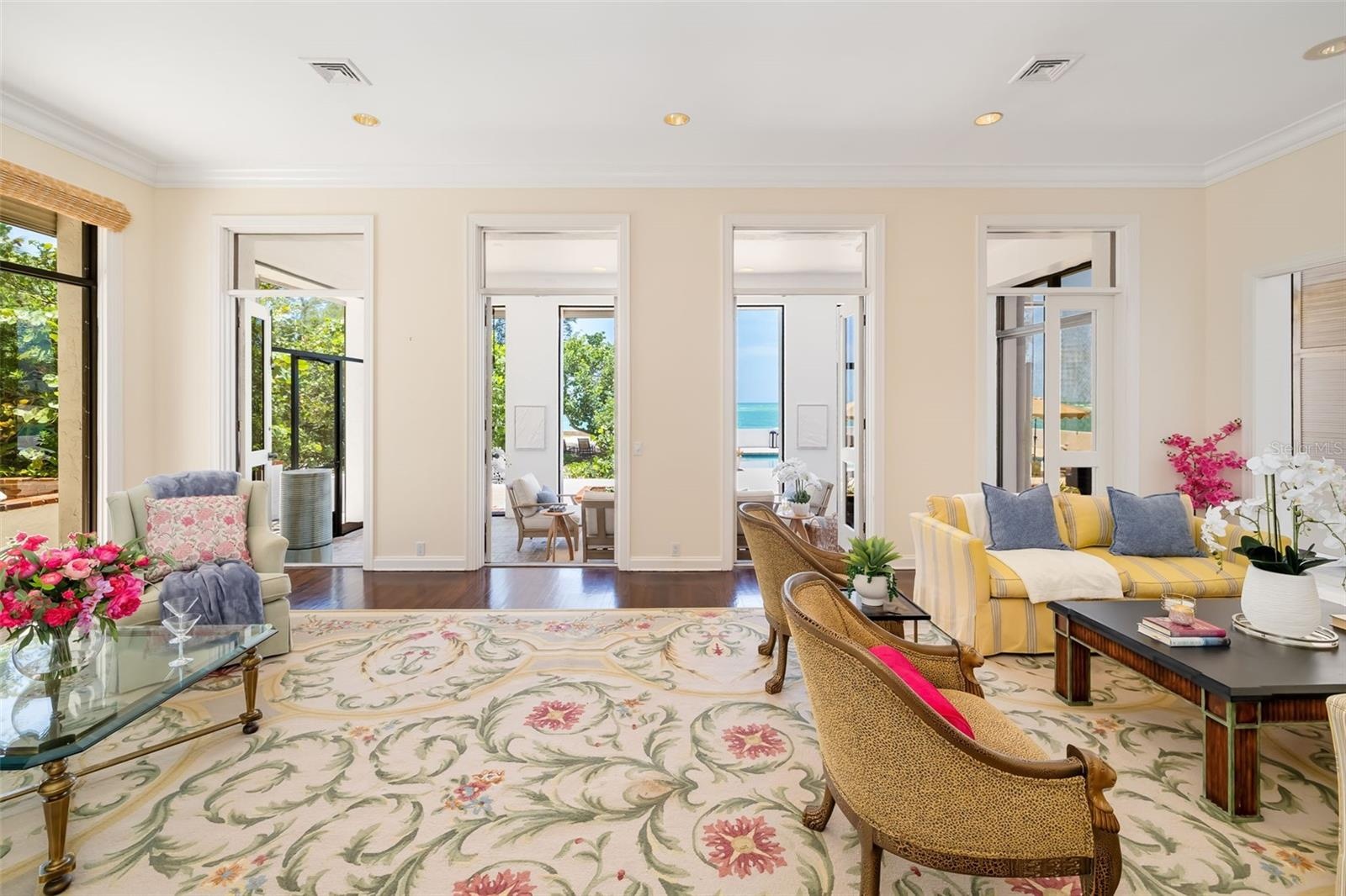 The formal living room is next to the library and the gathering room and flows nicely to and from.  The separation is an option and their are doors ar