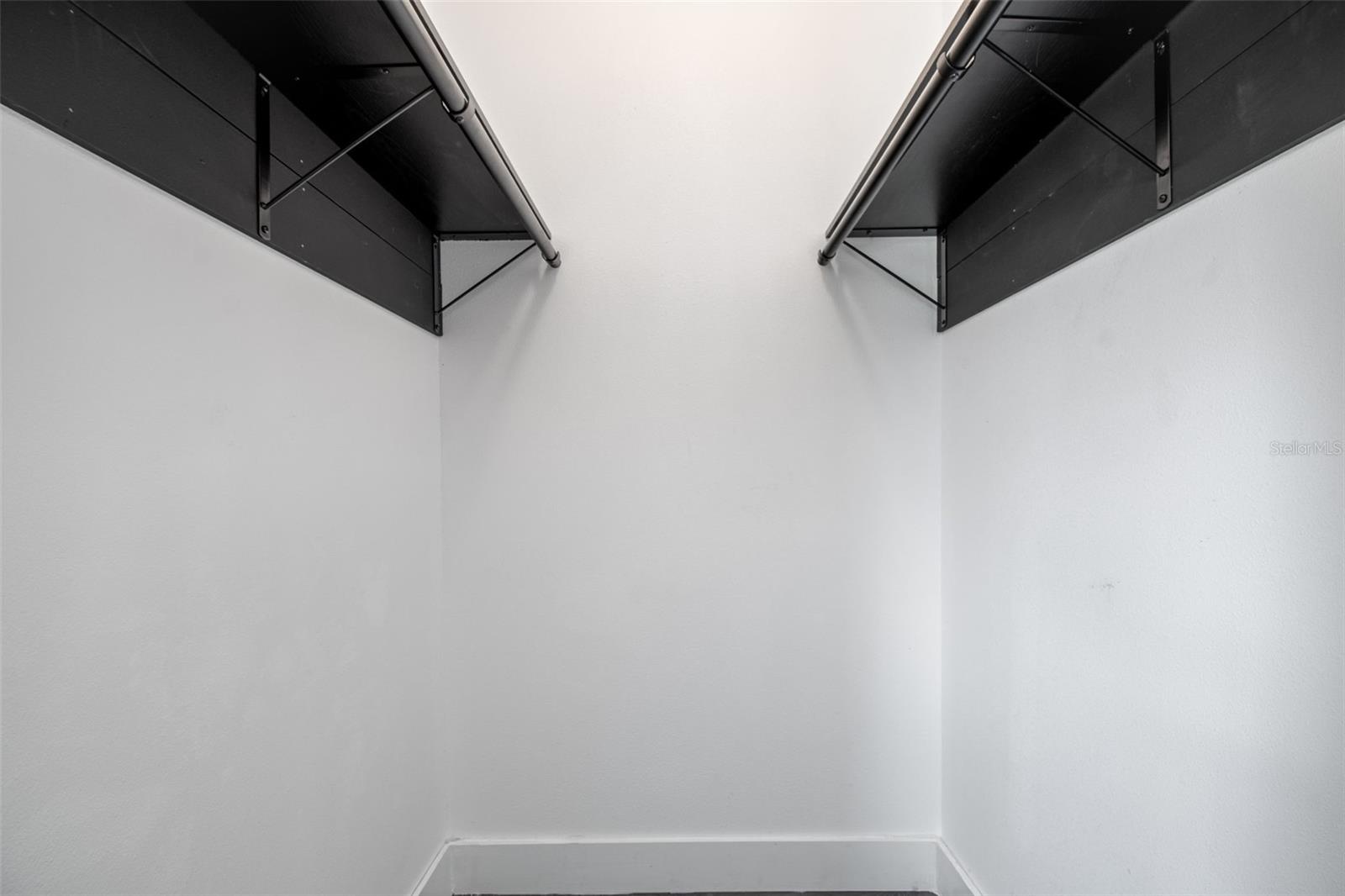 Primary bedroom walk-in closet