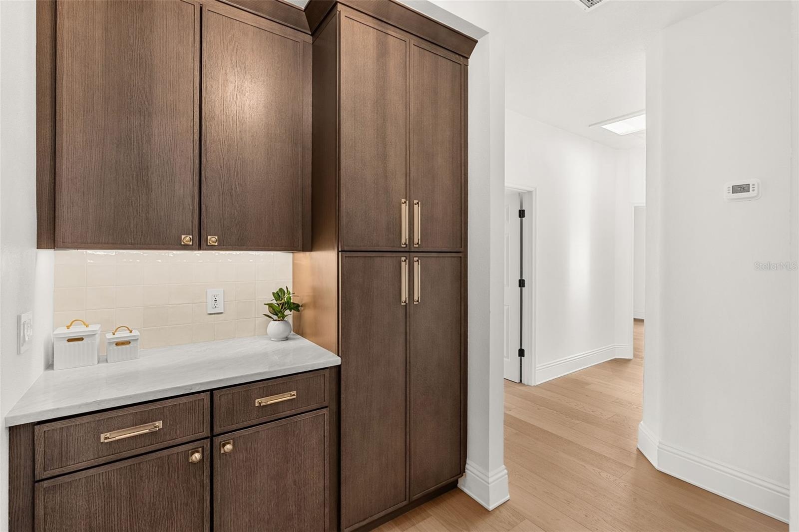 BUTLERS PANTRY TUCKED IN RIGHT BEHIND THE KITCHEN...LOTS OF STORAGE & A PREP AREA