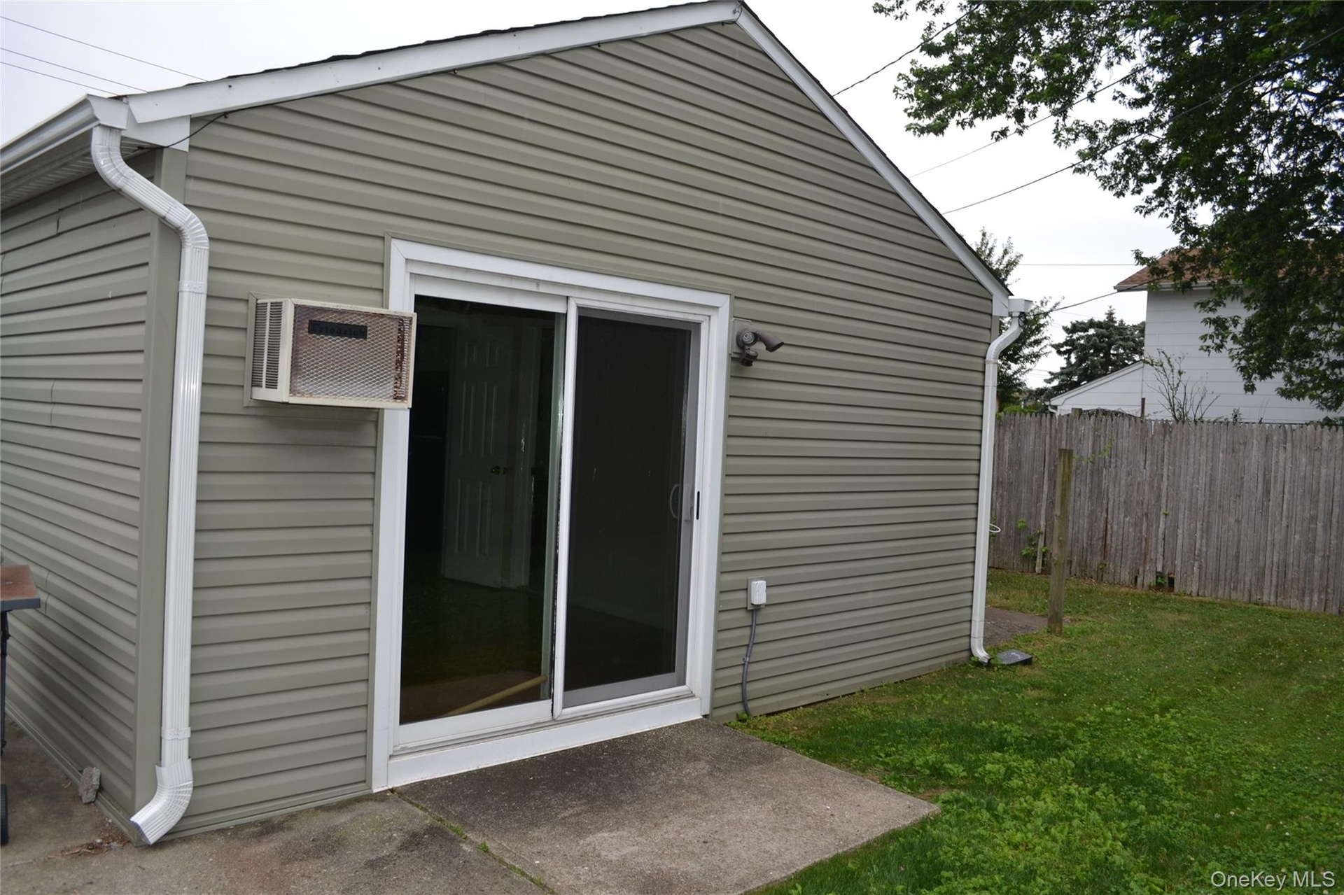 1BR unit sliding doors to yard