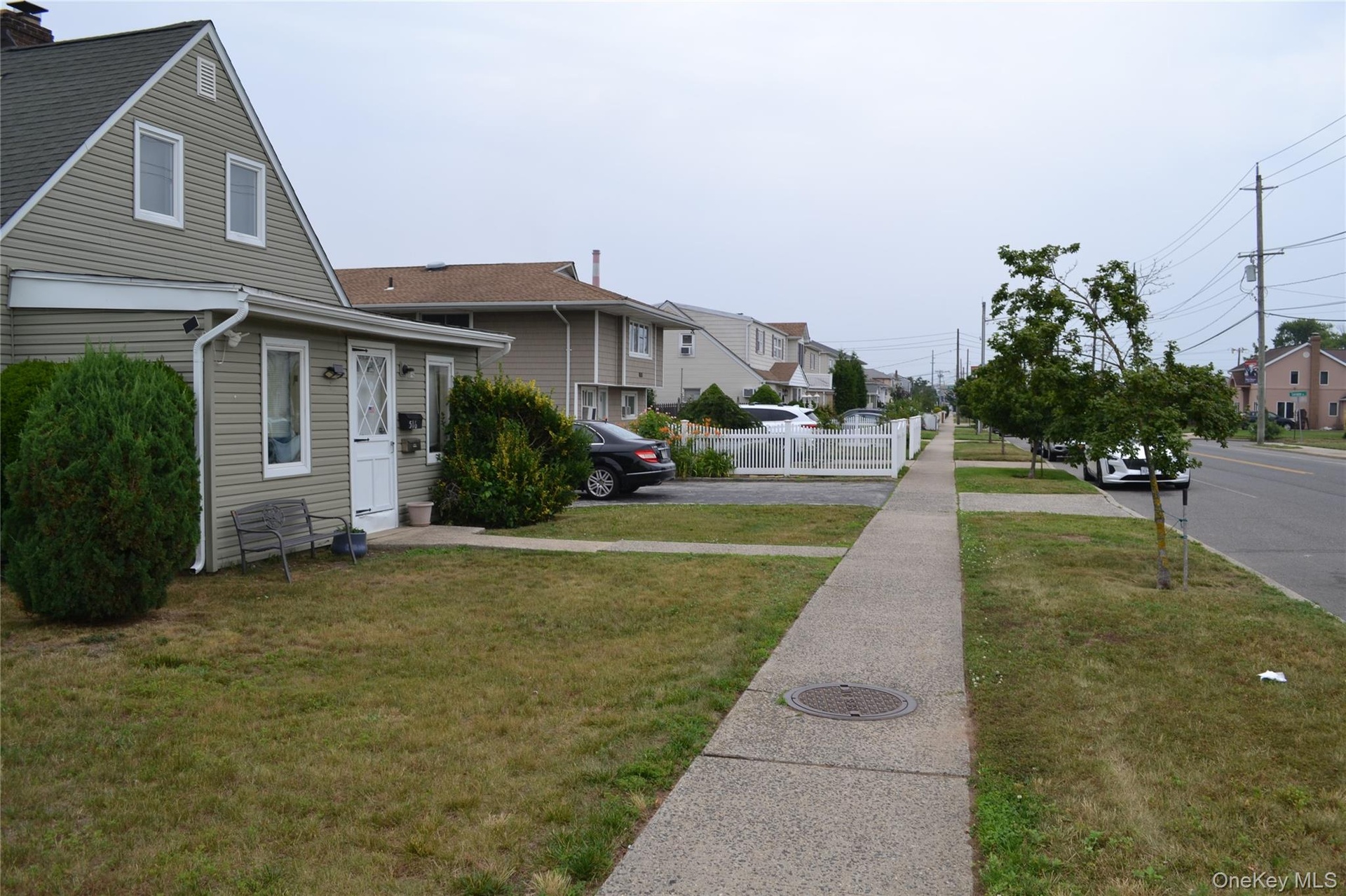 Sidewalk view front of house