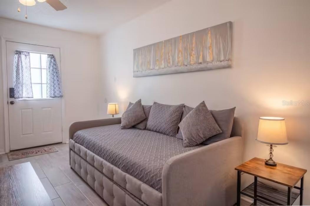sofa bed, side table with lamp