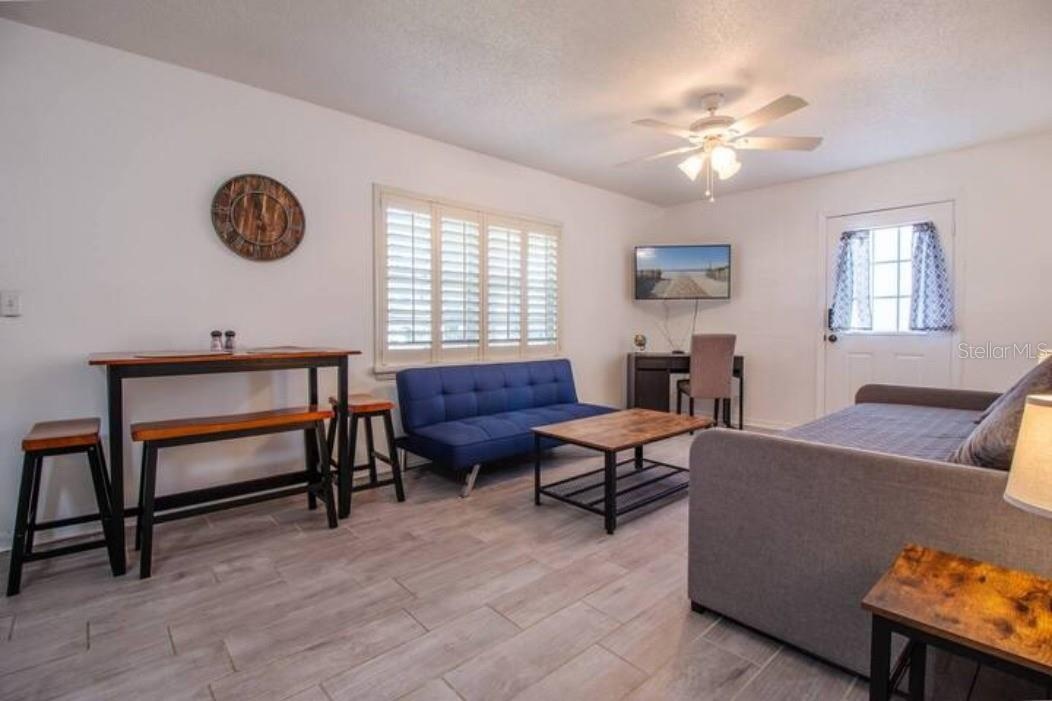 Shared living room with 2 sofa beds, dining table, tv, Laptop-friendly workspace