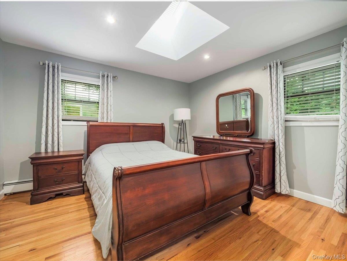 Hardwood flooring complemented by a skylight and recessed lighting