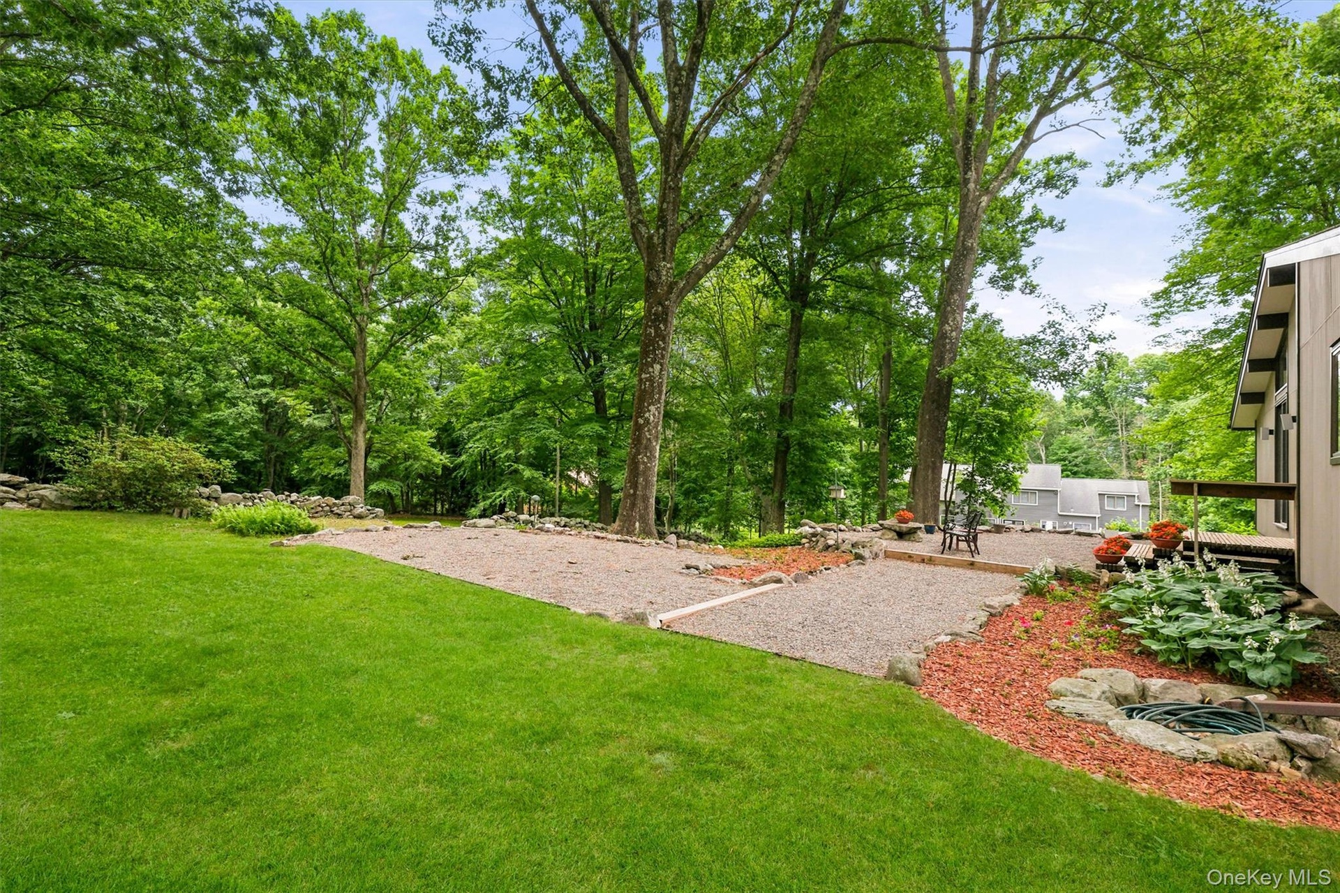 Expansive green lawn with mature trees