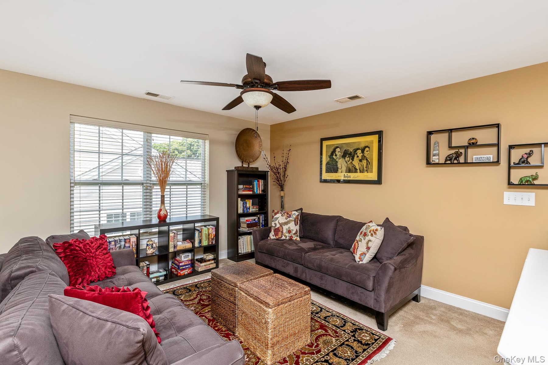 Upstairs Loft featuring a ceiling fan with integrated lighting,
