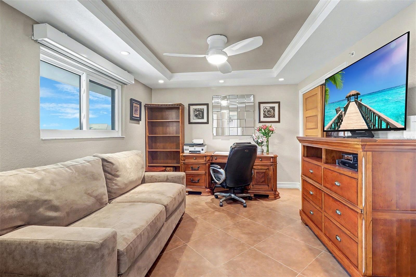 2nd Guest bedroom is thoughtfully designed and features a sofa bed, allowing the space to serve as both a private office and guest accommodations.