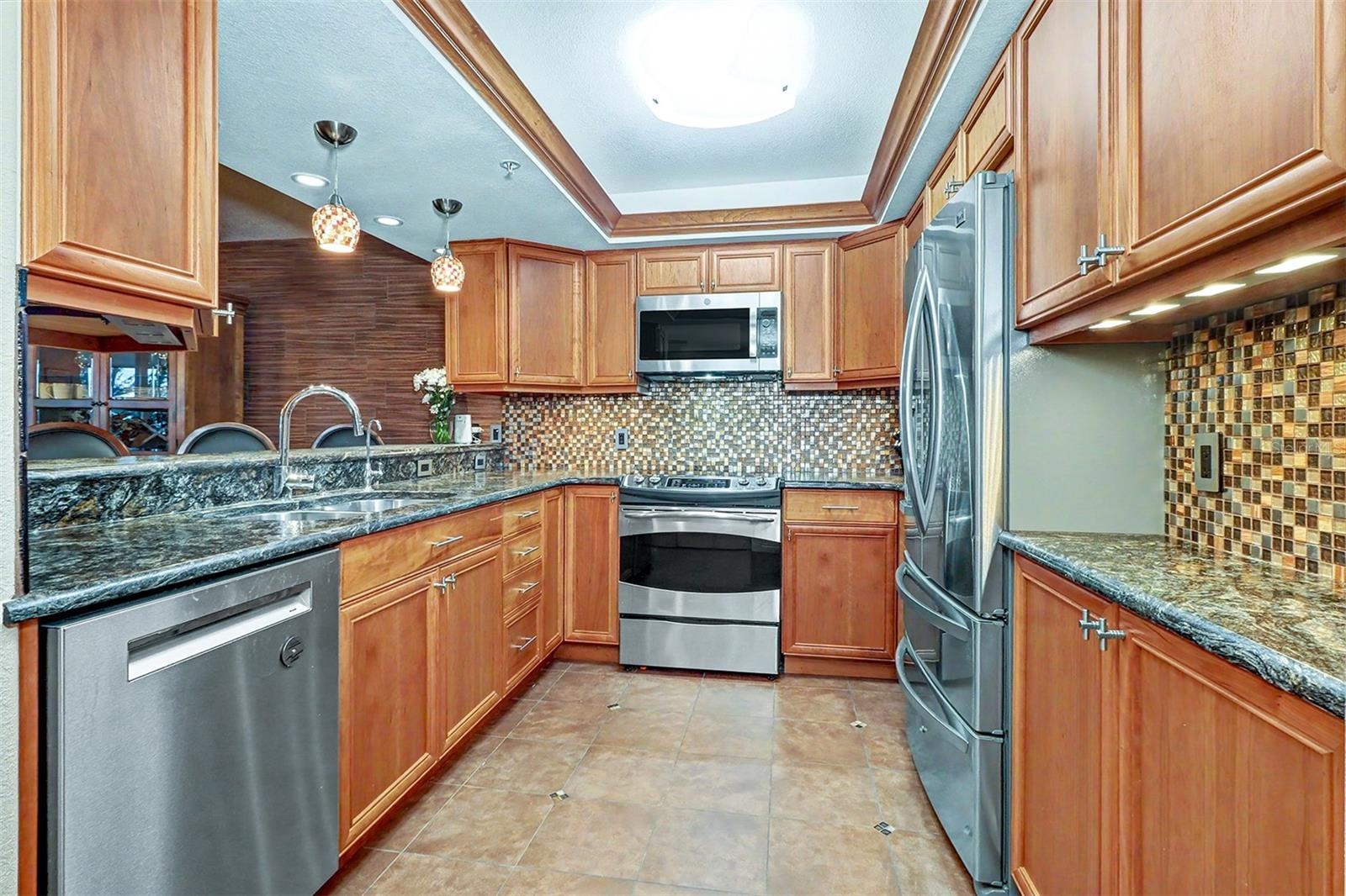 Lux leathered-Granite countertops, stainless appliances (2026 dishwasher & microwave), French door refridgerator and convection oven