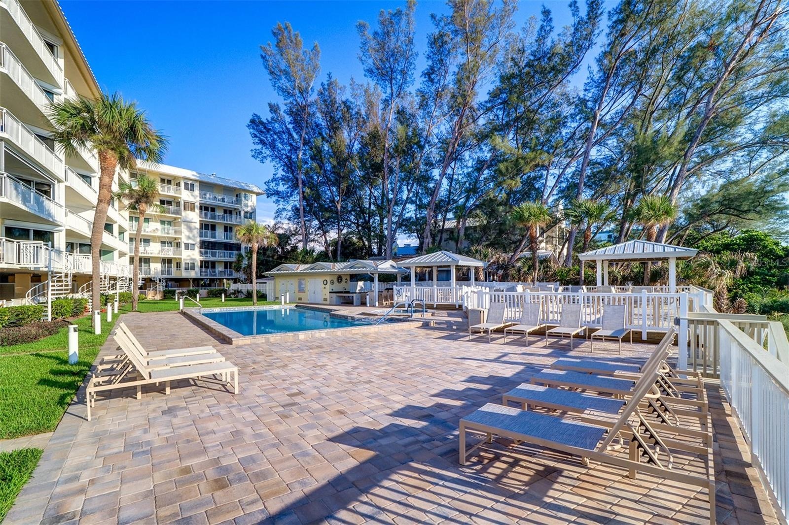 Pool deck offers loads of lounging options and is perfectly positioned to catch the seabreeze.