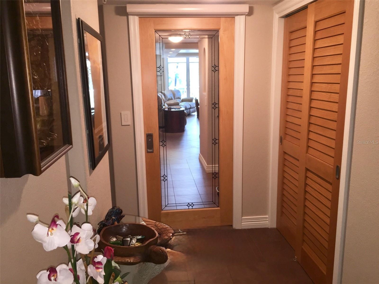 A discreet pocket door with a privacy shade separates the guest wing, creating a private retreat for the 2 guest bedrooms and bath.
