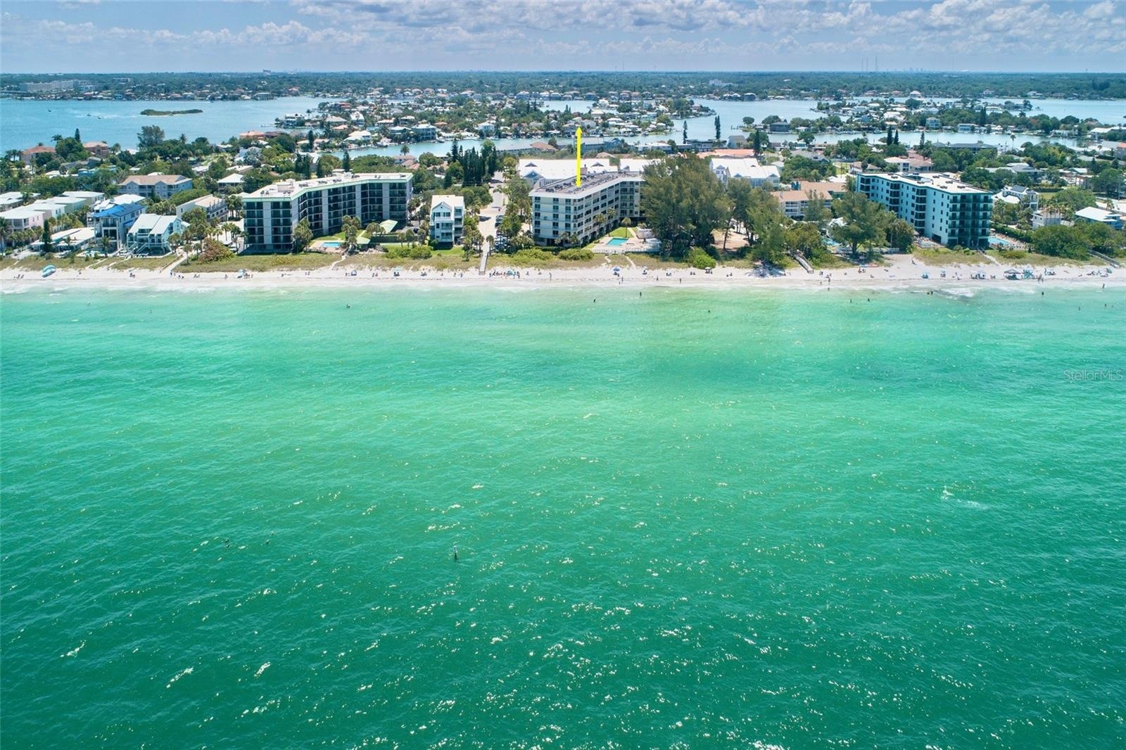 Clear  calm teal Gulf water on IndianRocks Beach looking East over Intracoastal Waterway.