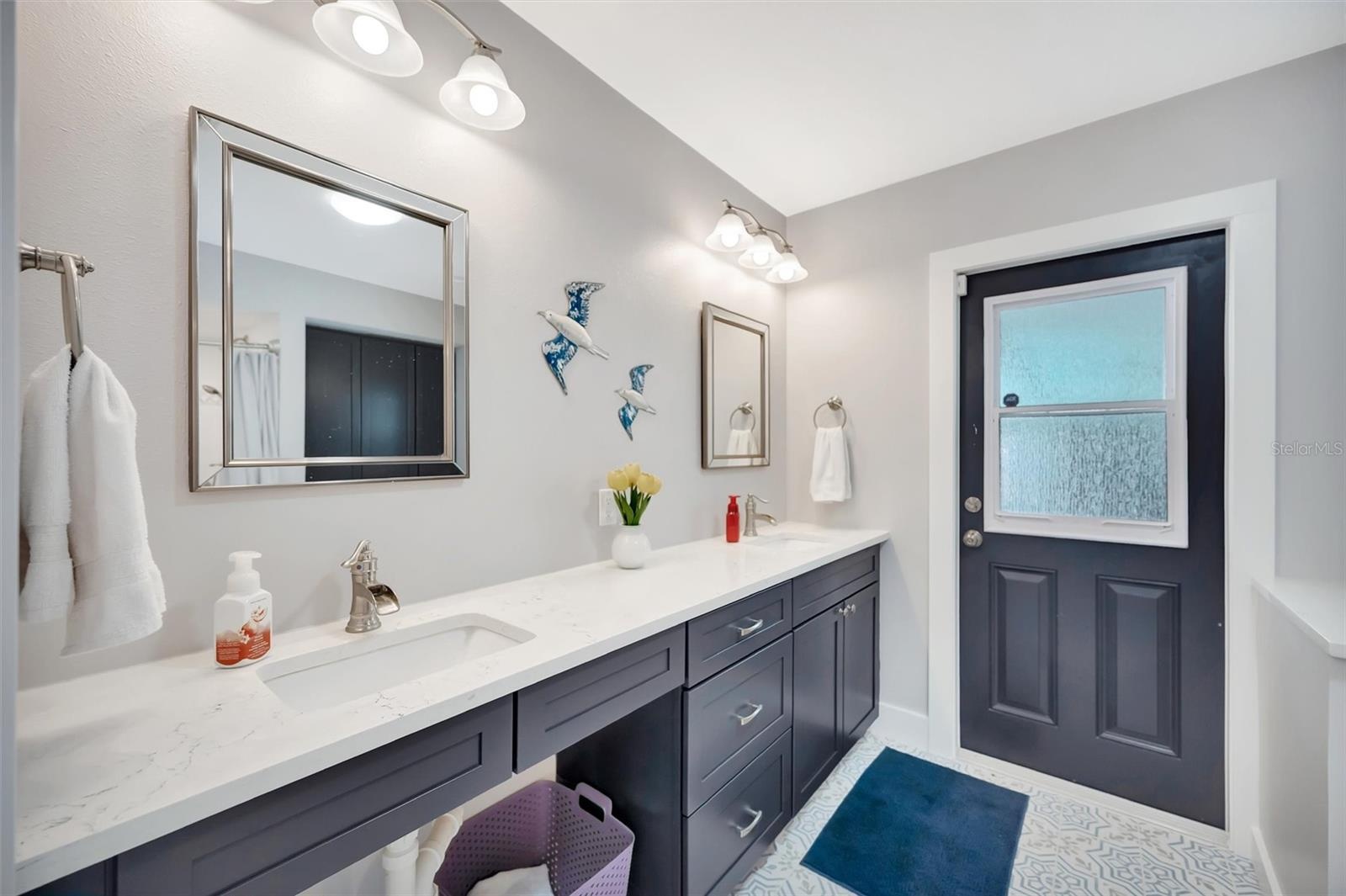 Spacious en-suite bathroom with access to the pool area