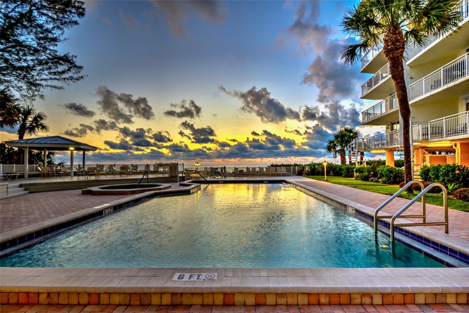 Seaside pool, spa, sun deck, and outdoor kitchen are absolutely glorious at sunset.