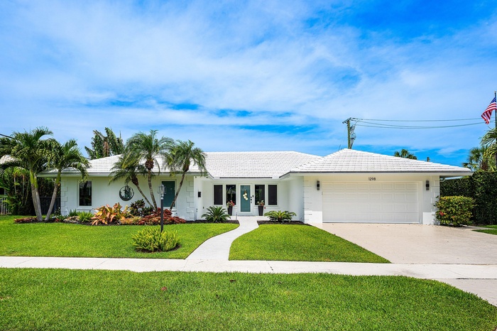 Meticulously Maintained & Reconstructed East Boca Home