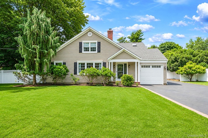 Approx 2500sqft + Full Basement  and 1 Car Garage Expanded Cape on .55 Acres