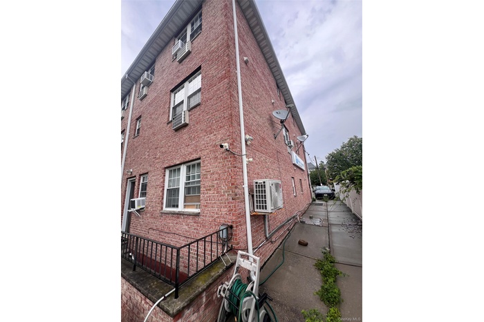 full brick corner lot newer building with full basement,  2 balconies, 1 sky light, total 4 units