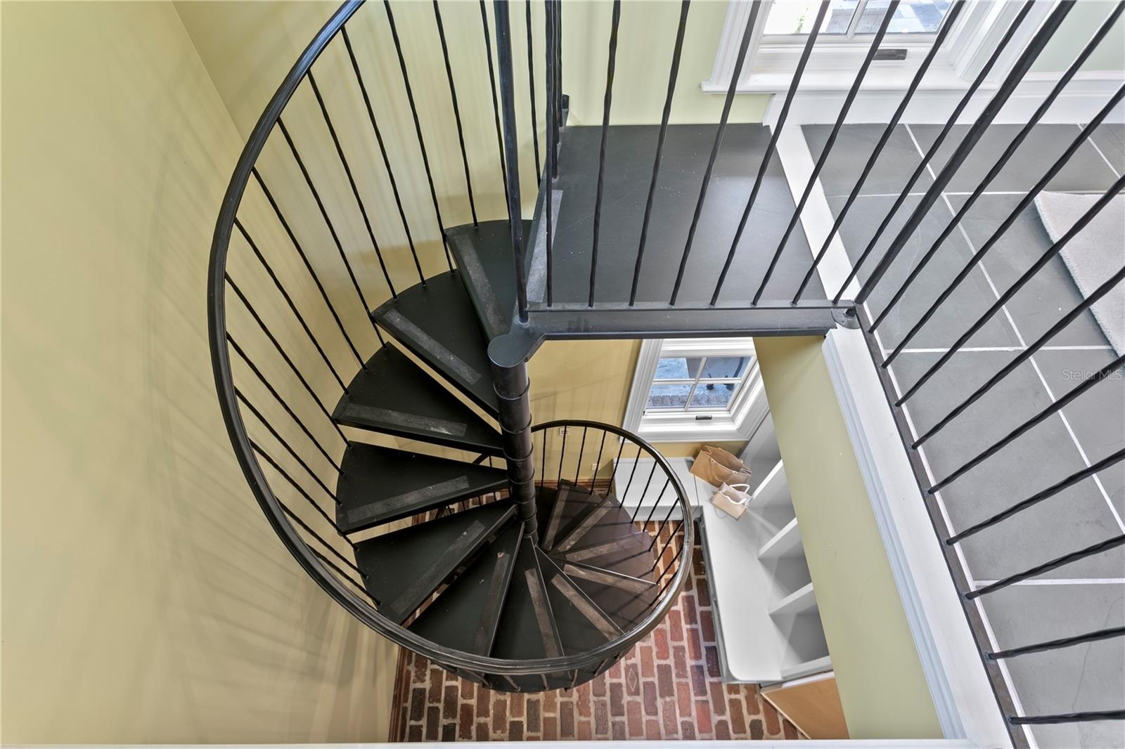 Spiral staircase in the mudroom up to the office/gym
