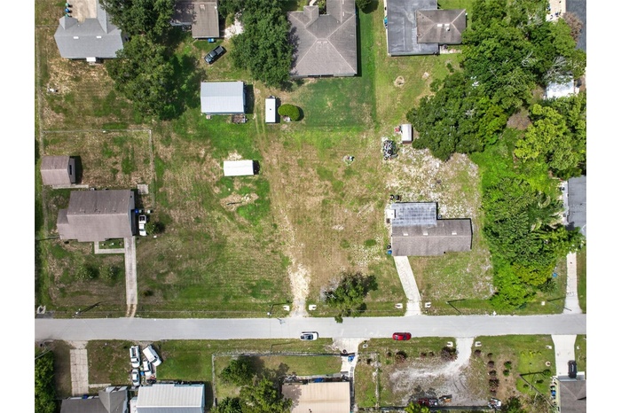 Aerial view with parcel boundary — 1.03 acres, up to 6 buildable 50'x150' lots.