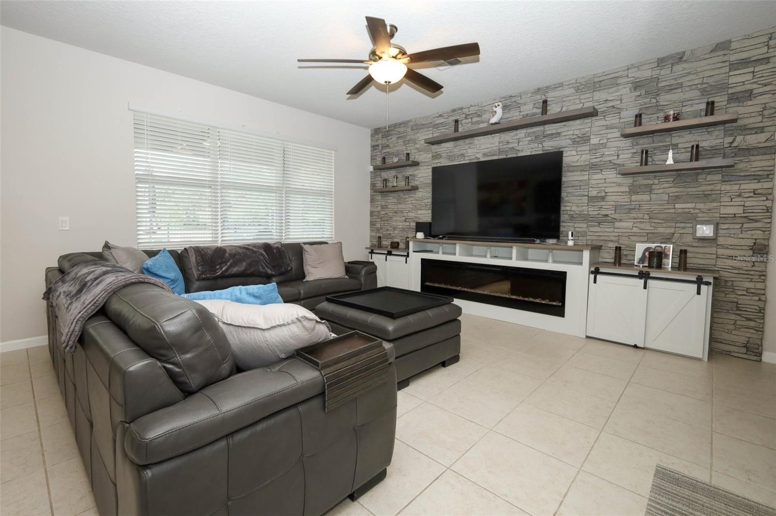 Great room / Custom built entertainment center / electric fireplace