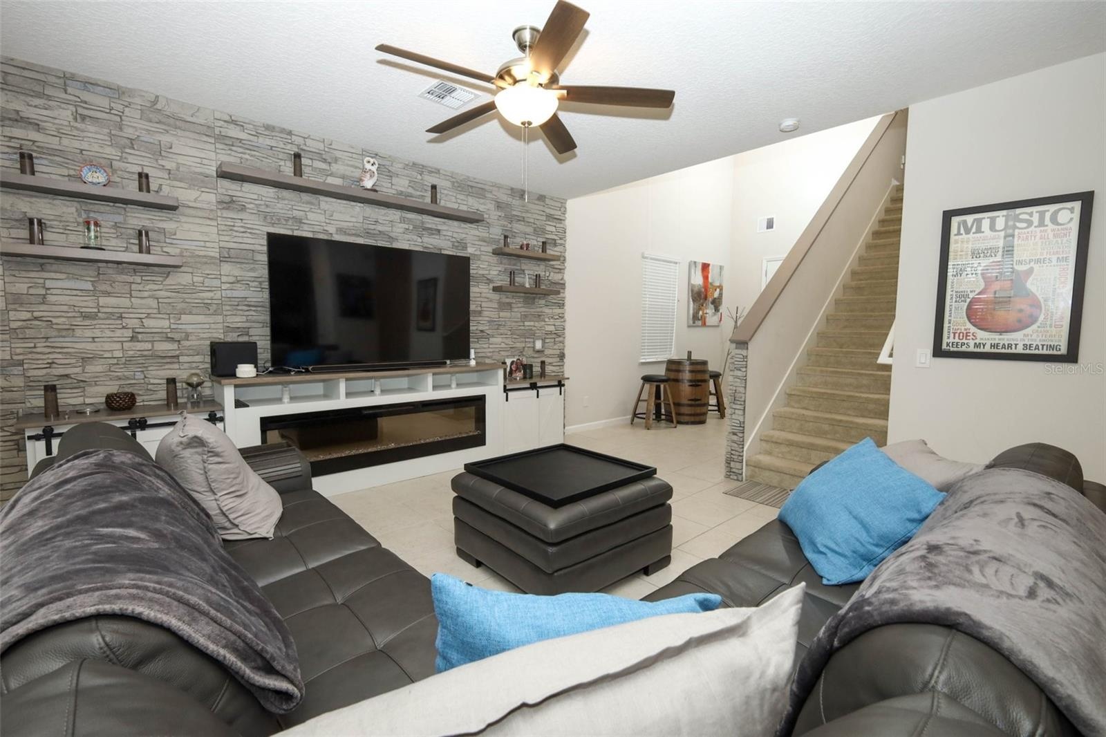 Great room / Custom built entertainment center / electric fireplace