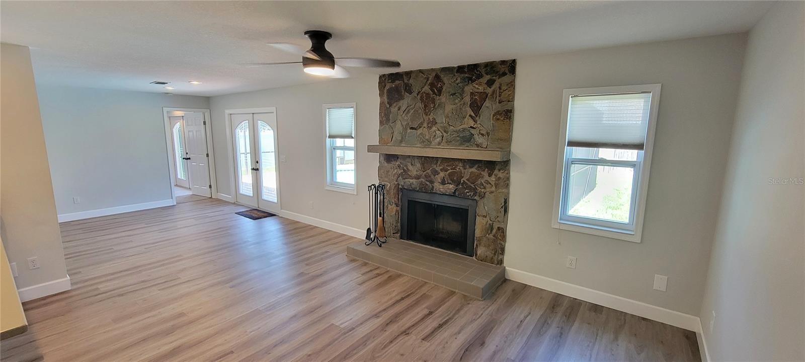Family room by the kitchen with a wood burning fireplace for those cool winter nights!