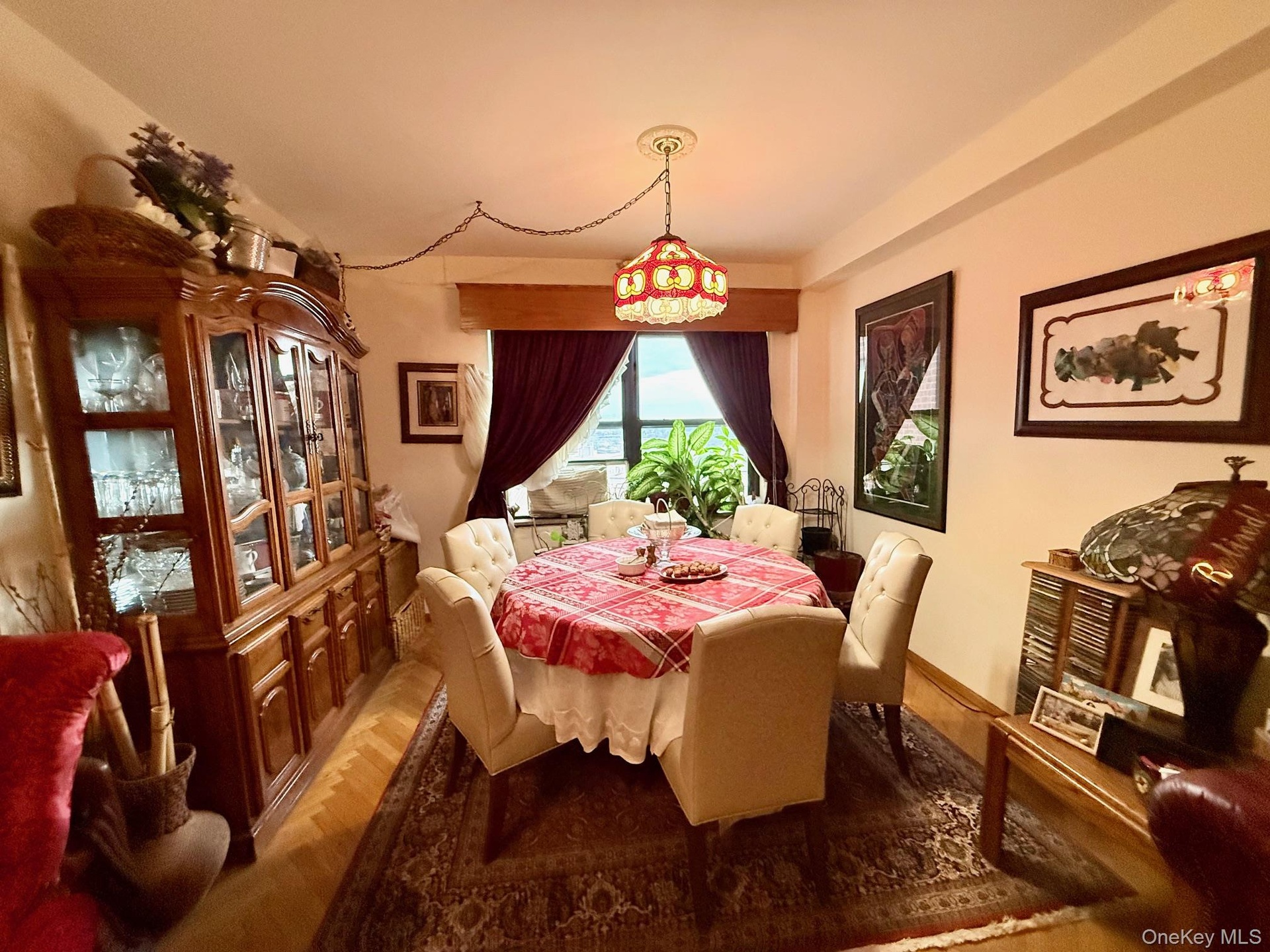 Open to the living room, double panel window, hardwood floors