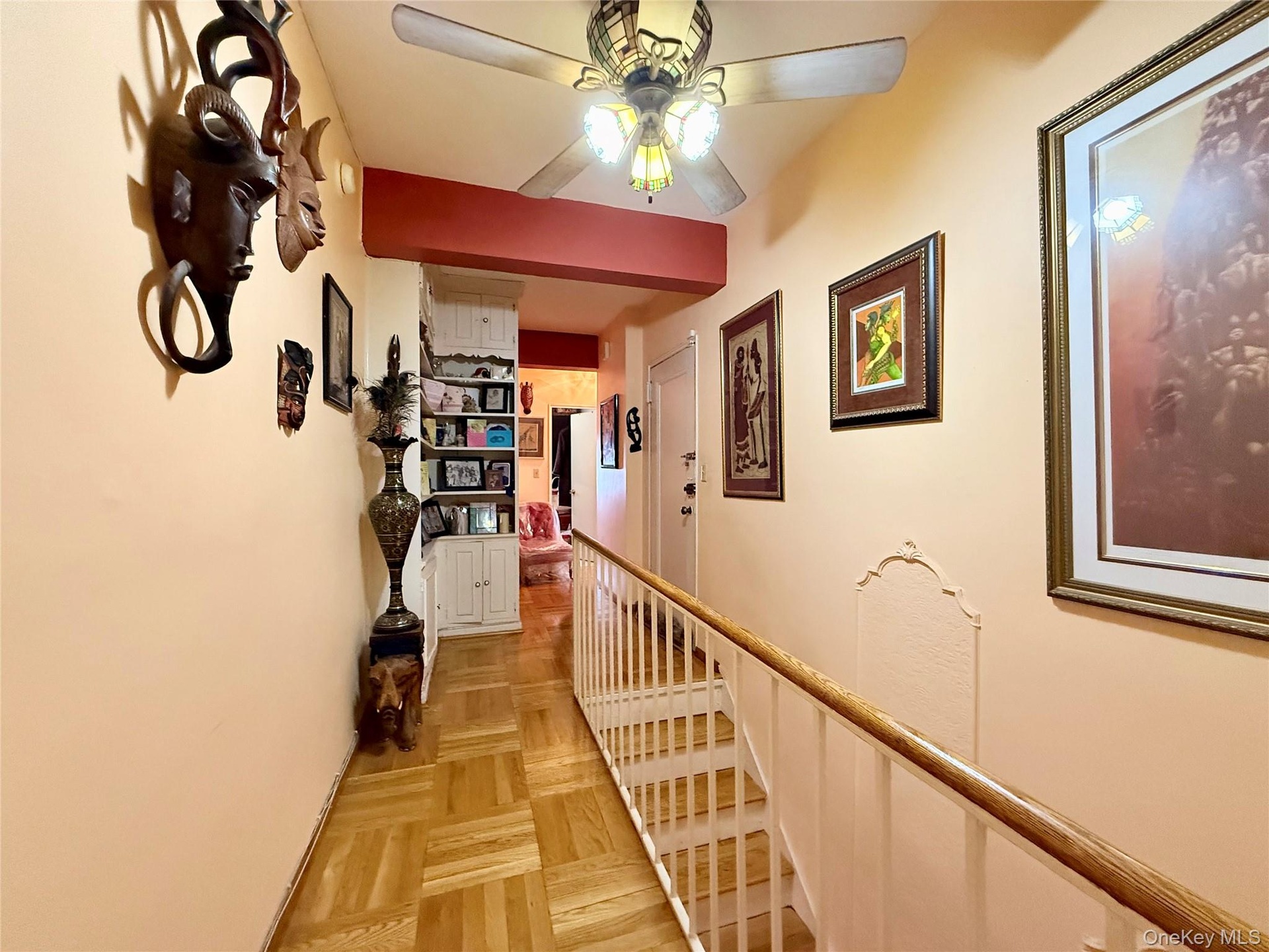 Stairs leading to the second floor. Access to the 10th floor from here. Built in unit at base of the stairs