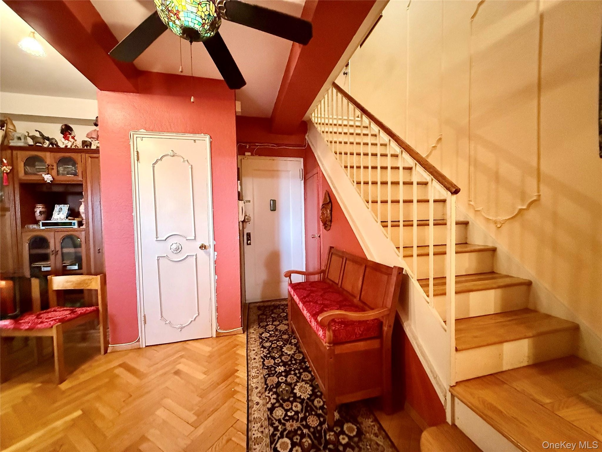 Main entrance on the 9th floor, hardwood floors, coat closet, storage under stairs, open to the dining area
