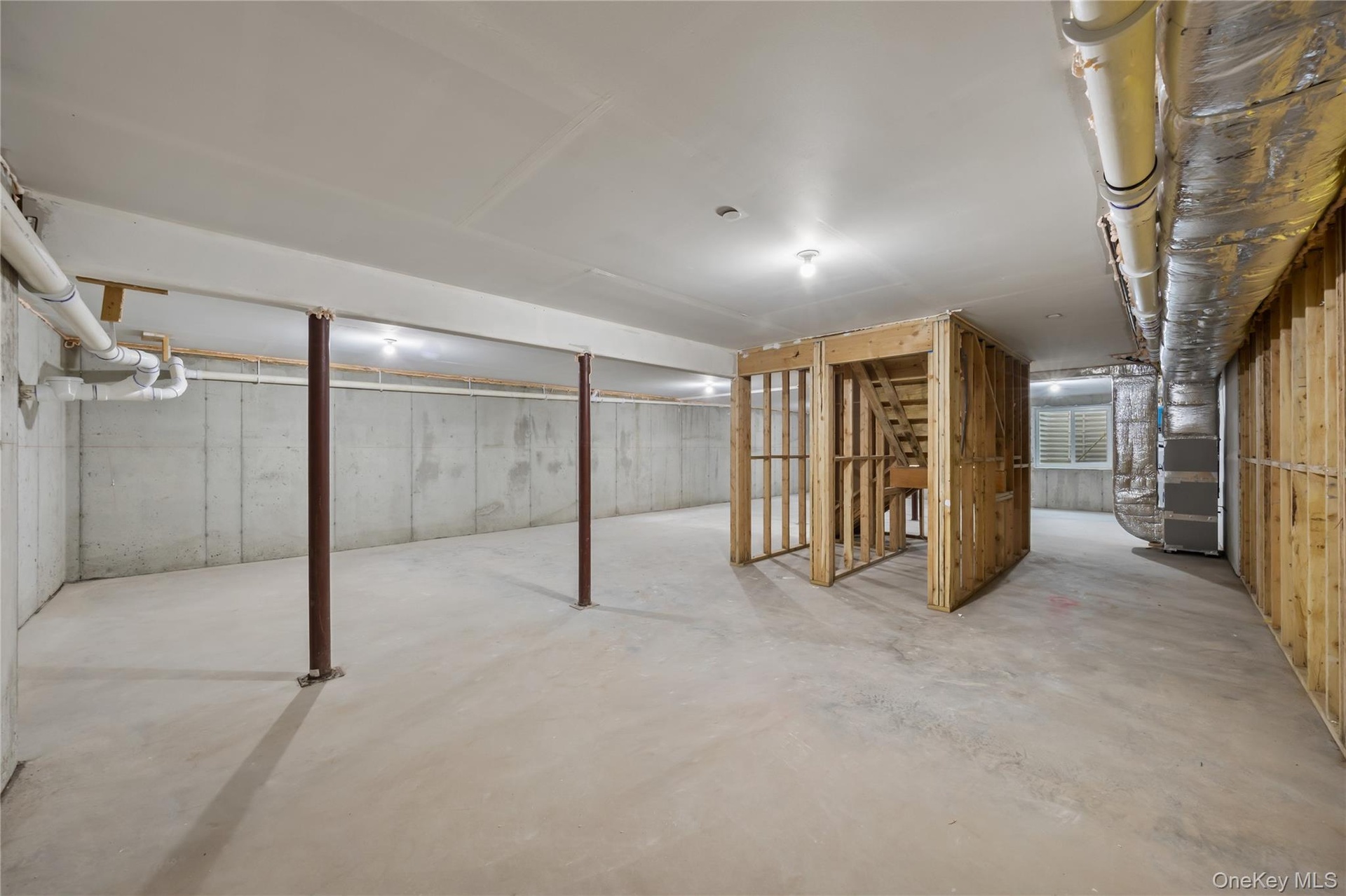 Unfinished below grade area with heating unit