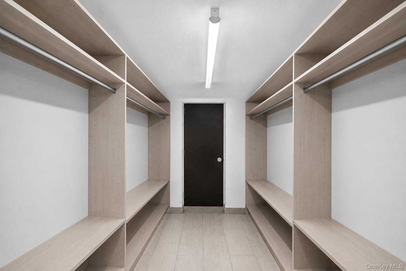 Virtually Staged walk-in closet area in lower  level.  Fabulous!
