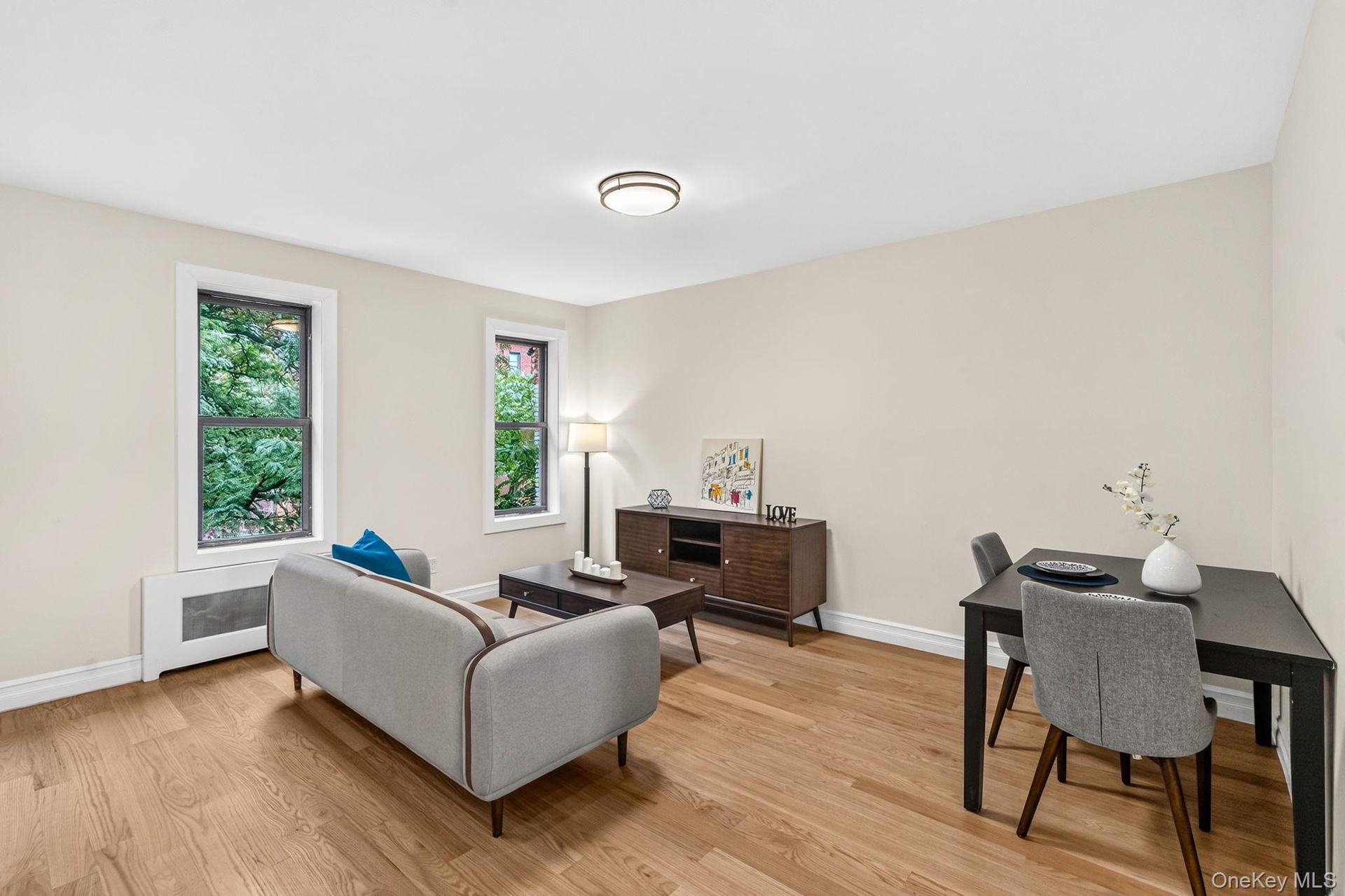Living room/dining and work space on main level -upper unit