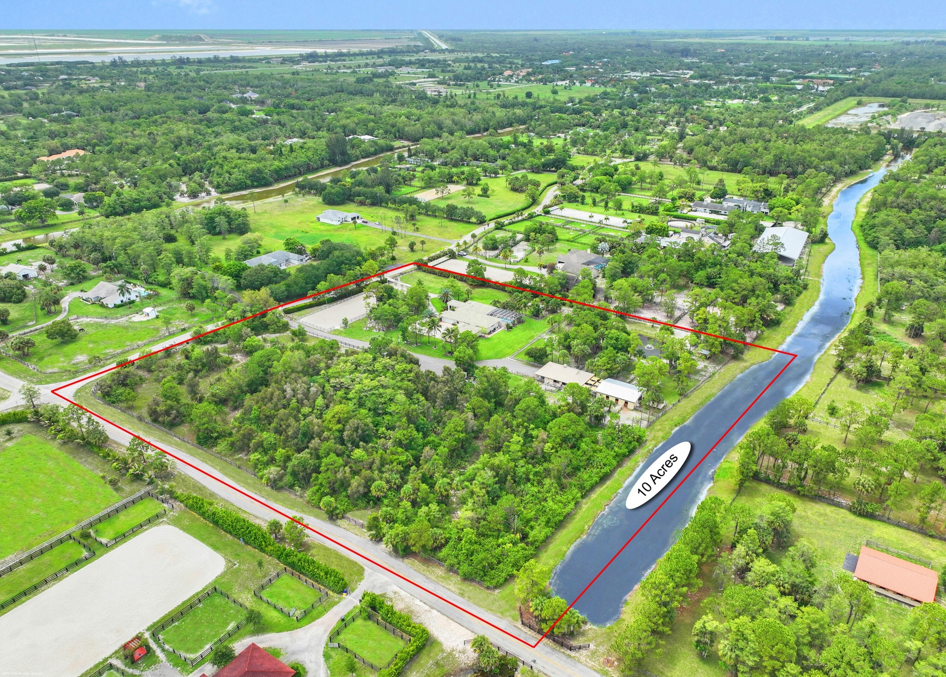 10-acre corner lot with direct bridle path access.