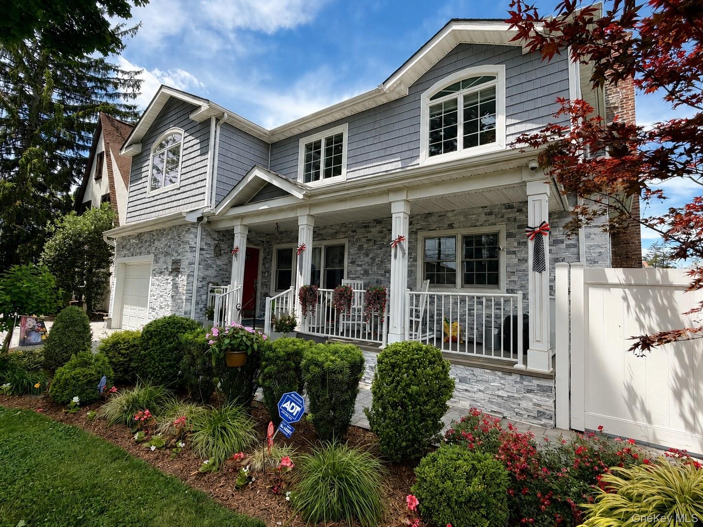 Beautifully landscaped front yard with stunning curb appeal.