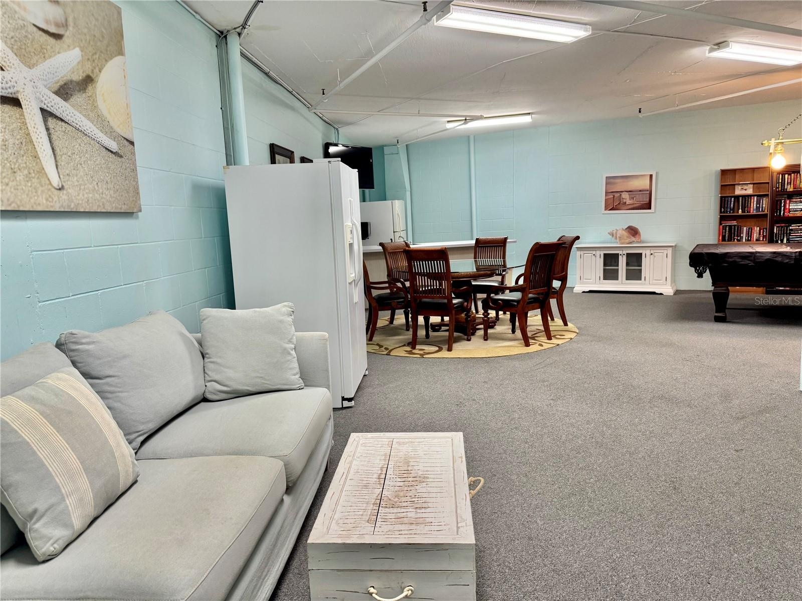 5th Floor ACTIVITIES ROOM "Game Room" features a billiard / pool table, TV, dining table for 6, couch, piano, library and refrigerator for Community o