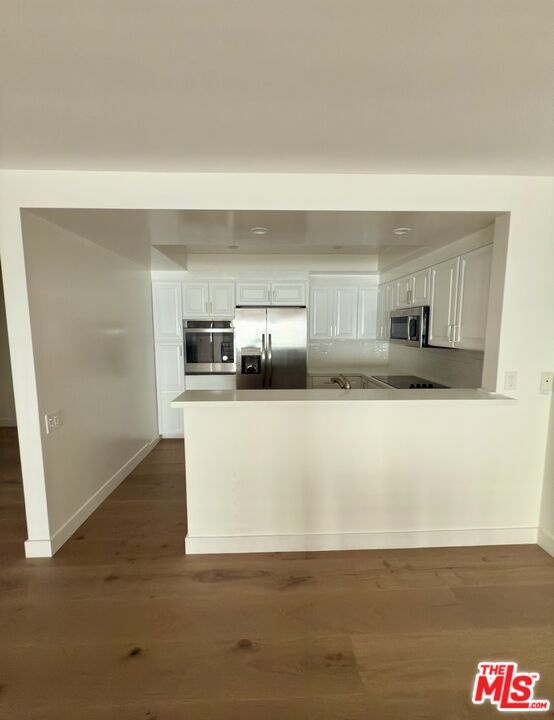 View of kitchen from dining ar