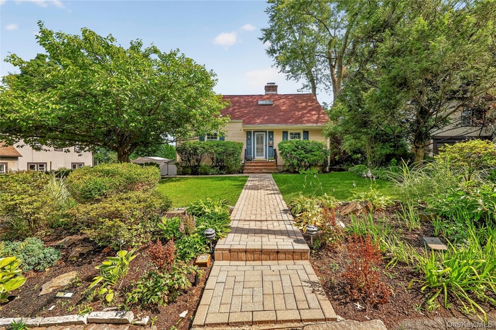 Elegant brick walk way welcomes you to 67 Topland Road.