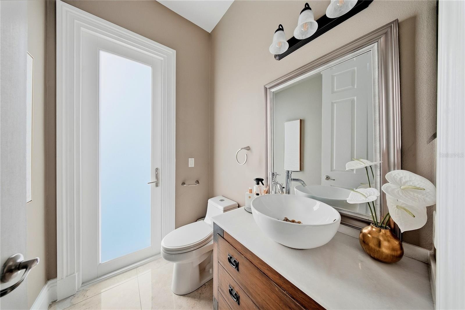 This half bath is downstairs and in a perfect location for guests.