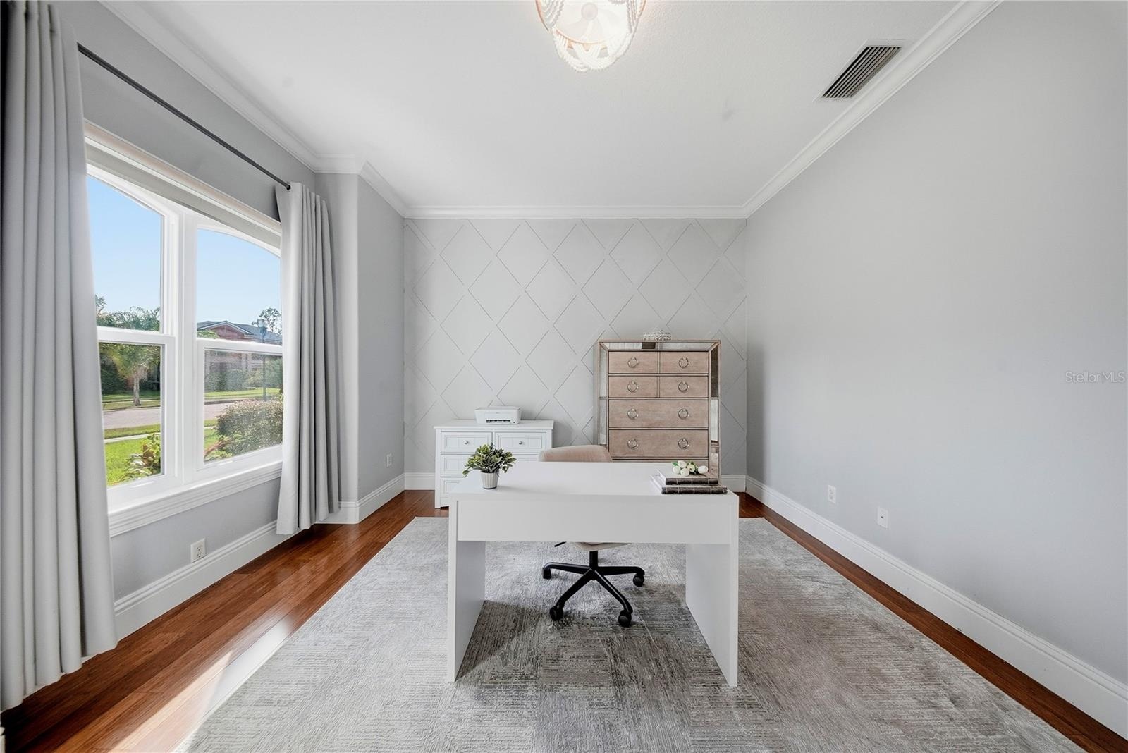 This room has plenty of natural light, and could be used as a home office or hobby room