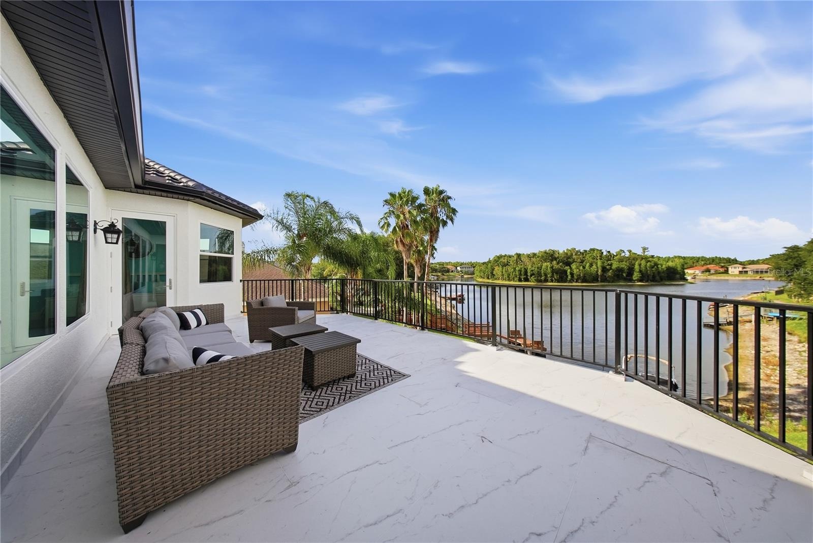 The upstairs balcony view of the lake is just as impressive and this balcony as ample room for lounging.