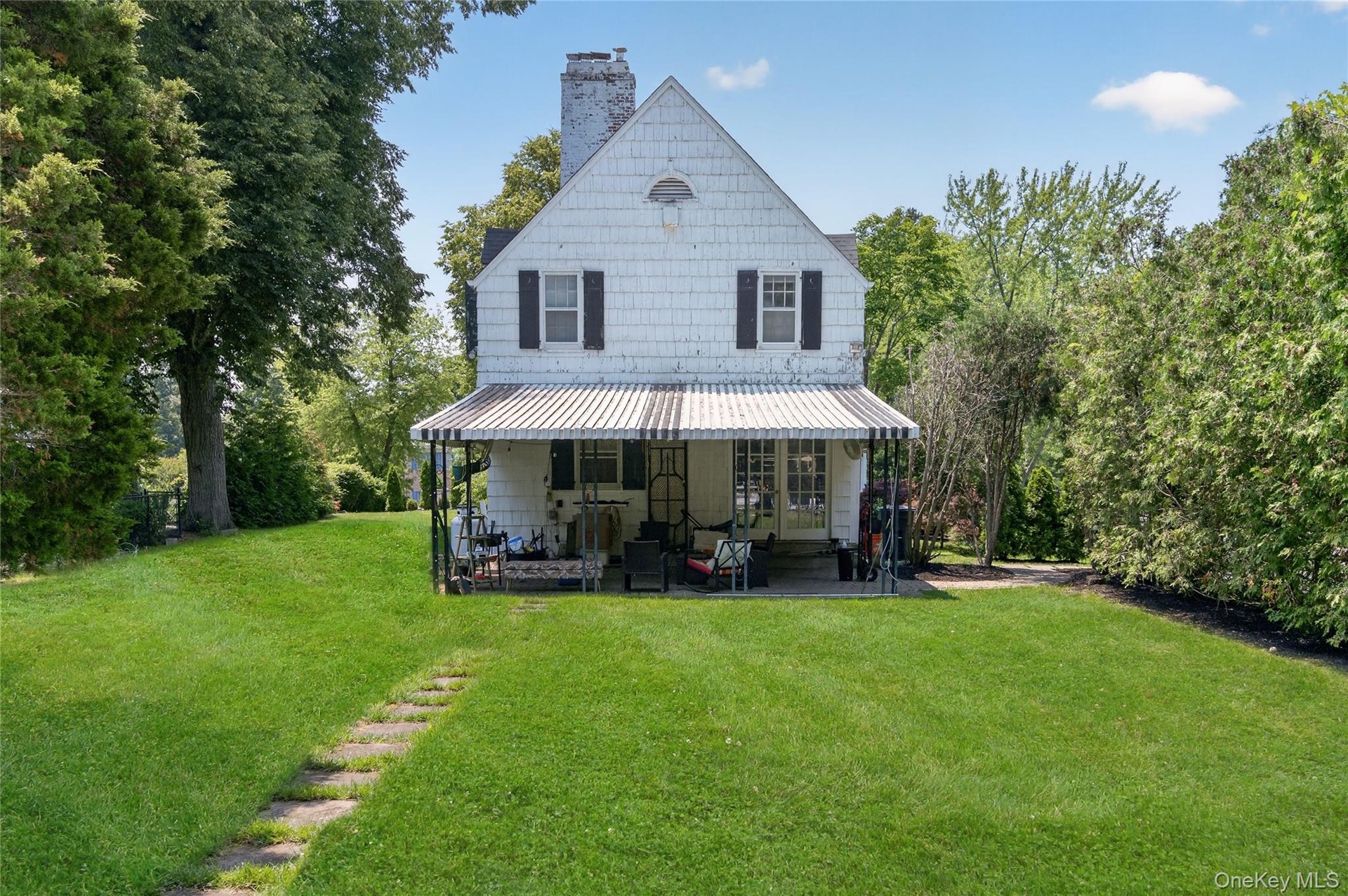 Side of home with covered patio