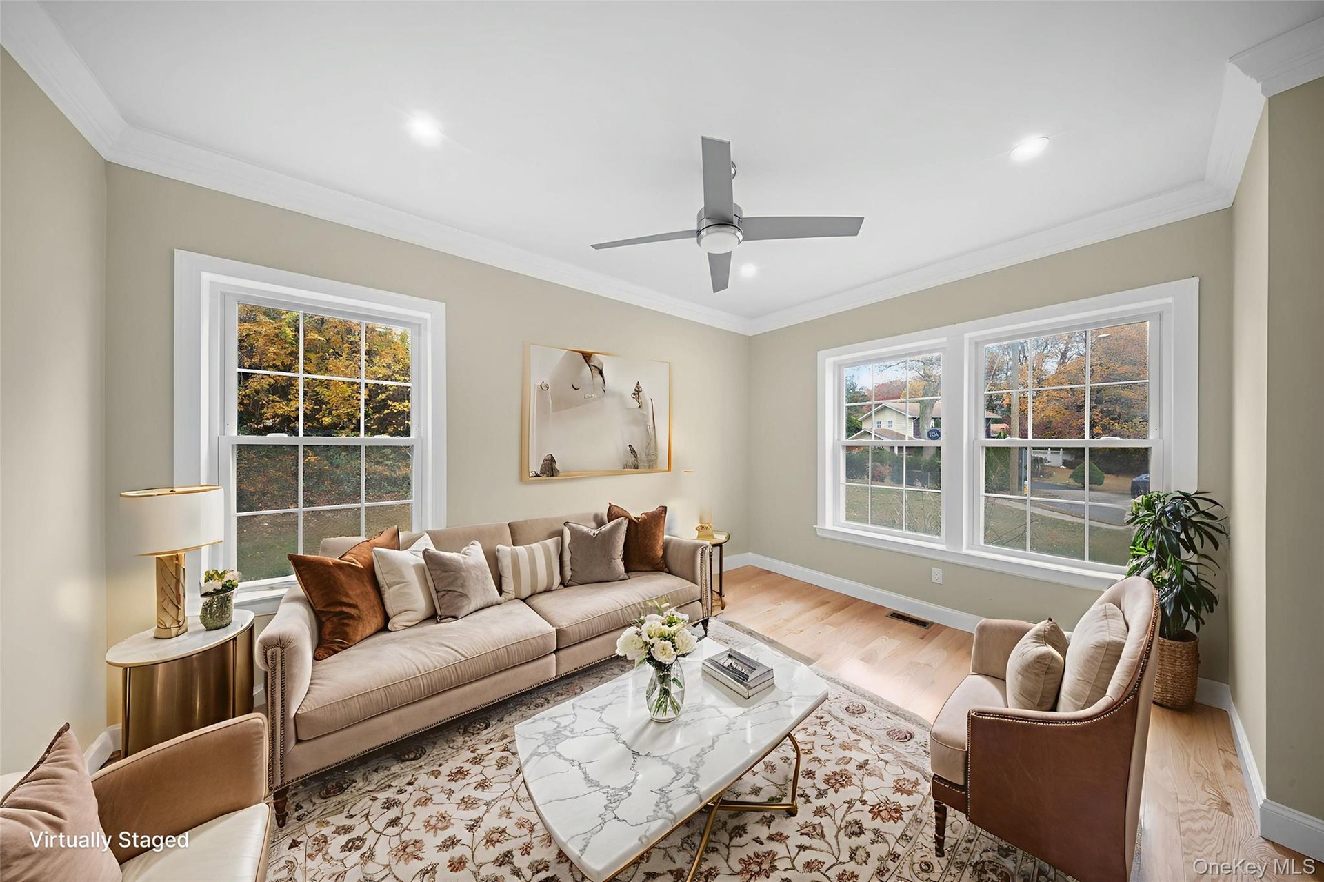 Living room featuring ornamental molding, plenty of natural light, wood finished floors, ceiling fan, and recessed lighting