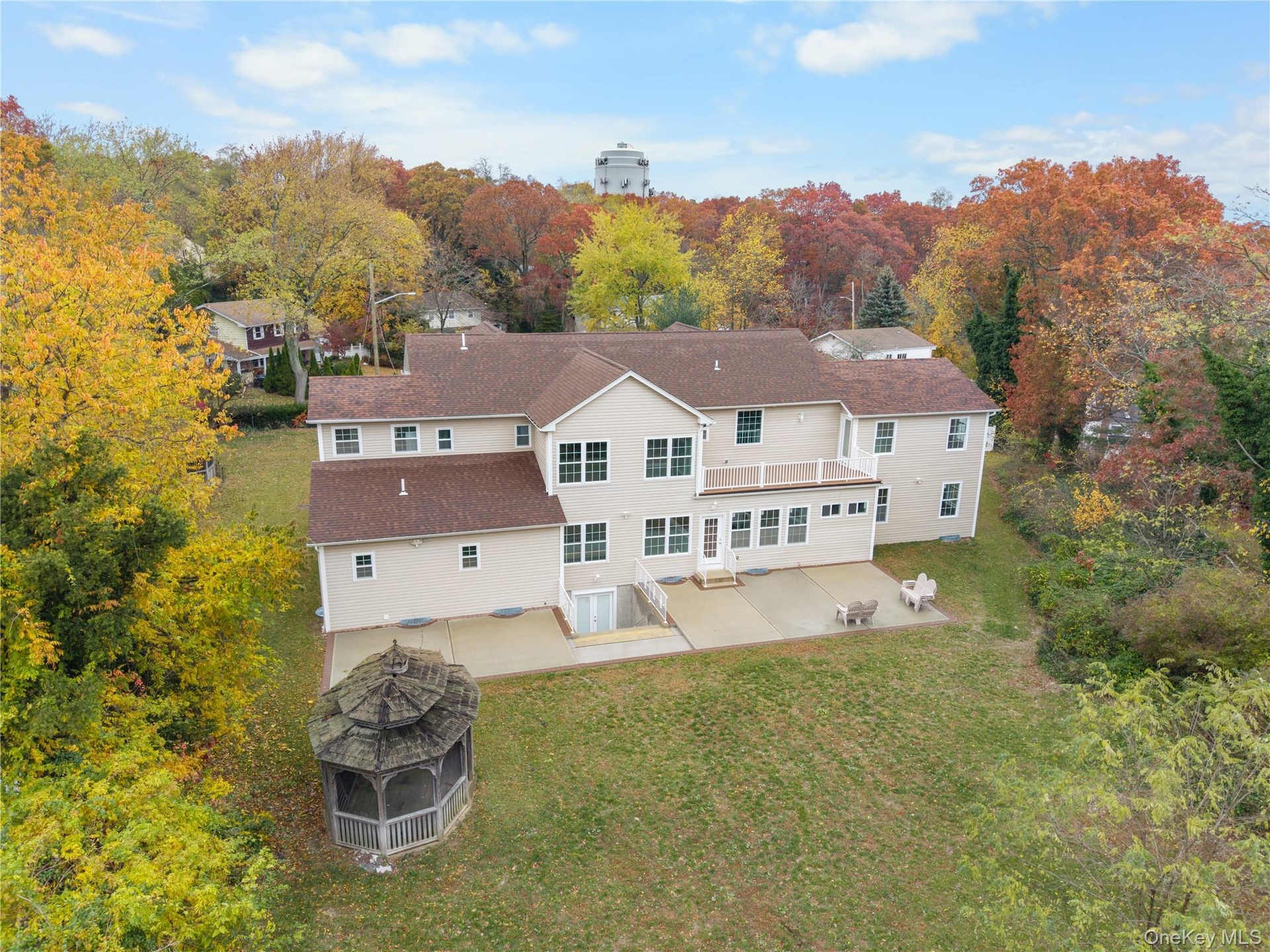 Back of house featuring a patio area and a yard