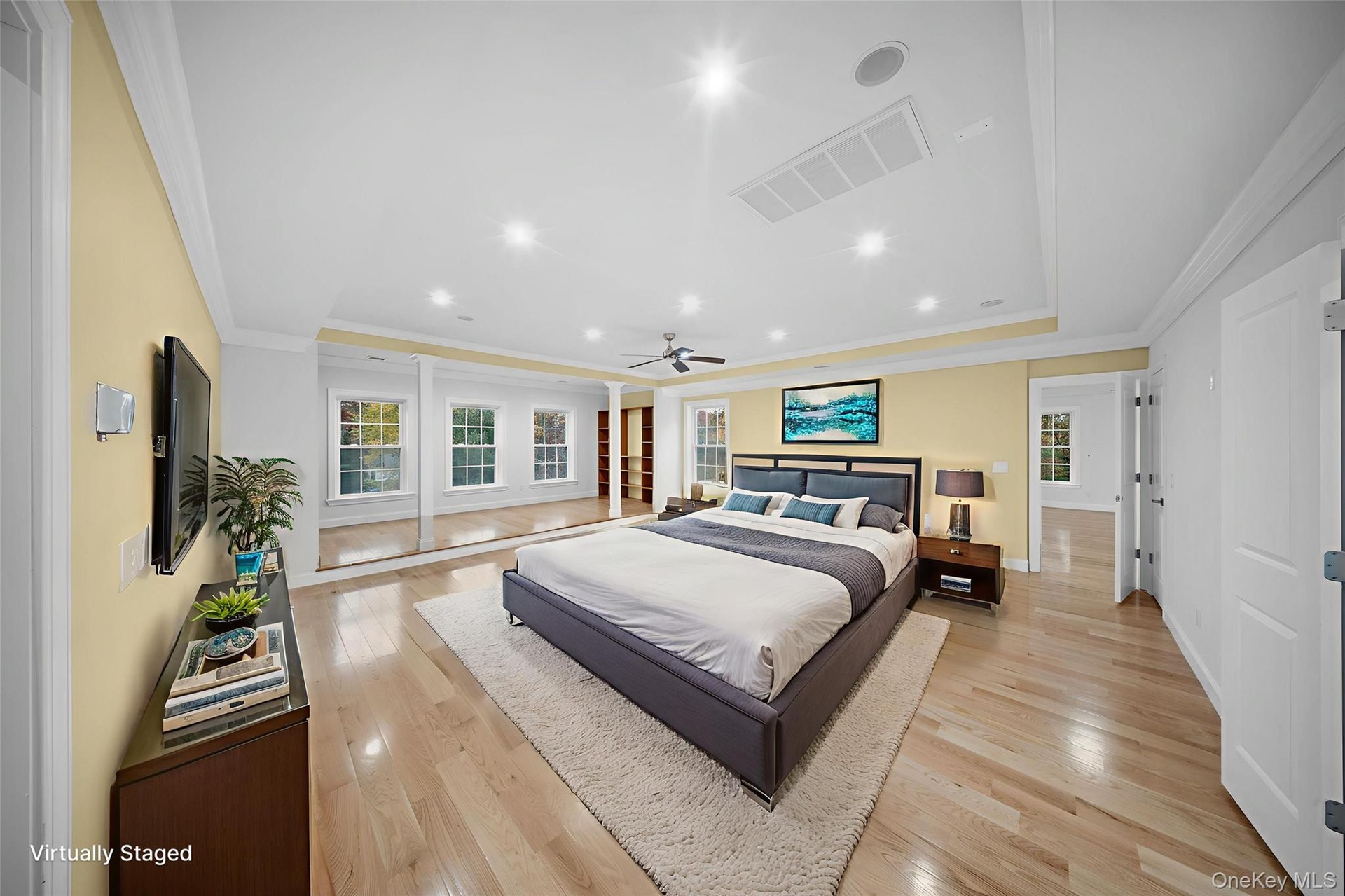 Bedroom featuring light wood finished floors, recessed lighting, and crown molding