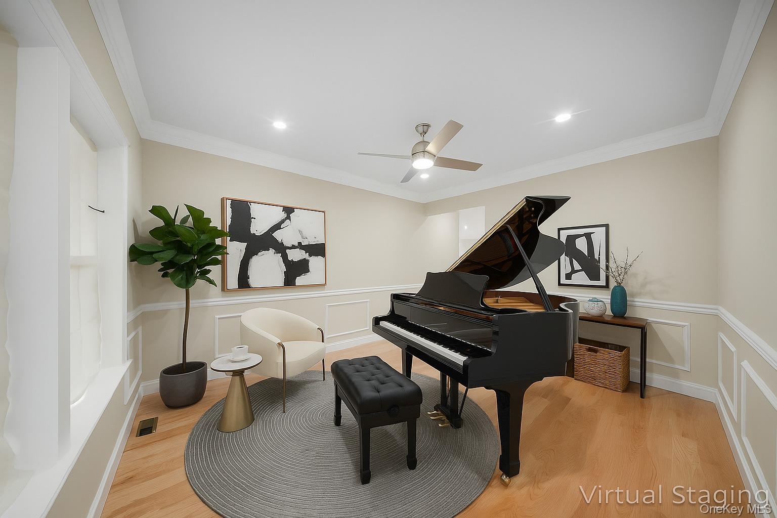 Sitting room with ornamental molding, wainscoting, light wood-style floors, a decorative wall, and recessed lighting