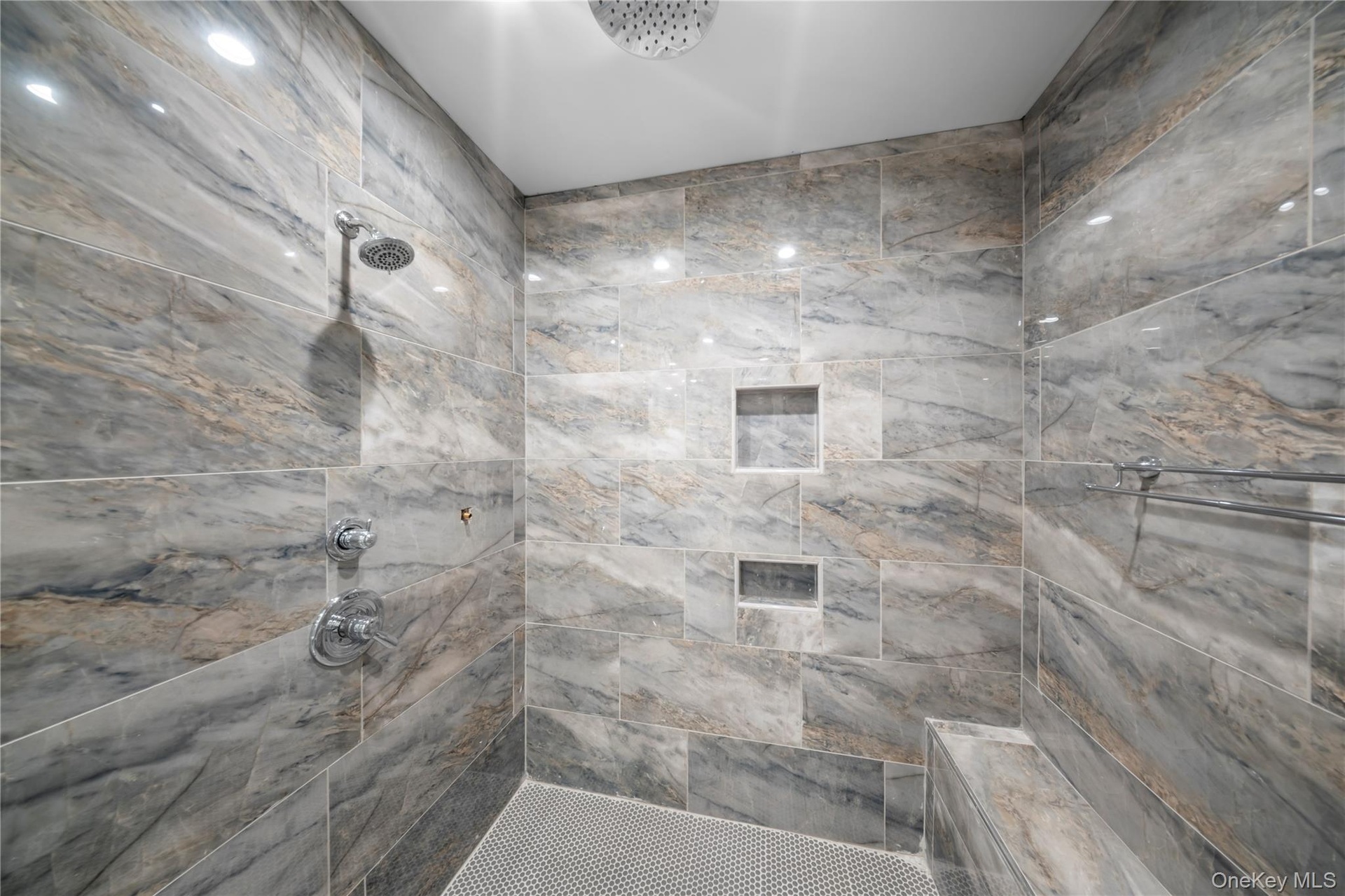 Full bathroom with a tile shower
