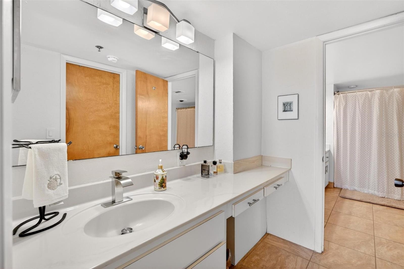 Primary bath with separate counter space and sinks