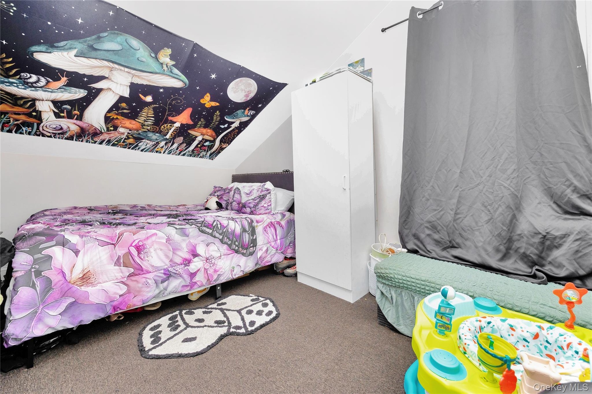 Bedroom featuring vaulted ceiling and carpet