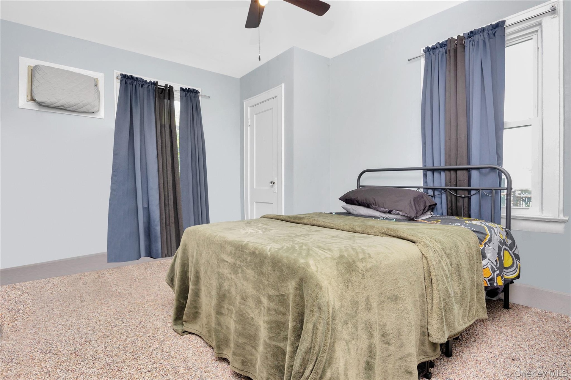 Bedroom featuring carpet and a ceiling fan