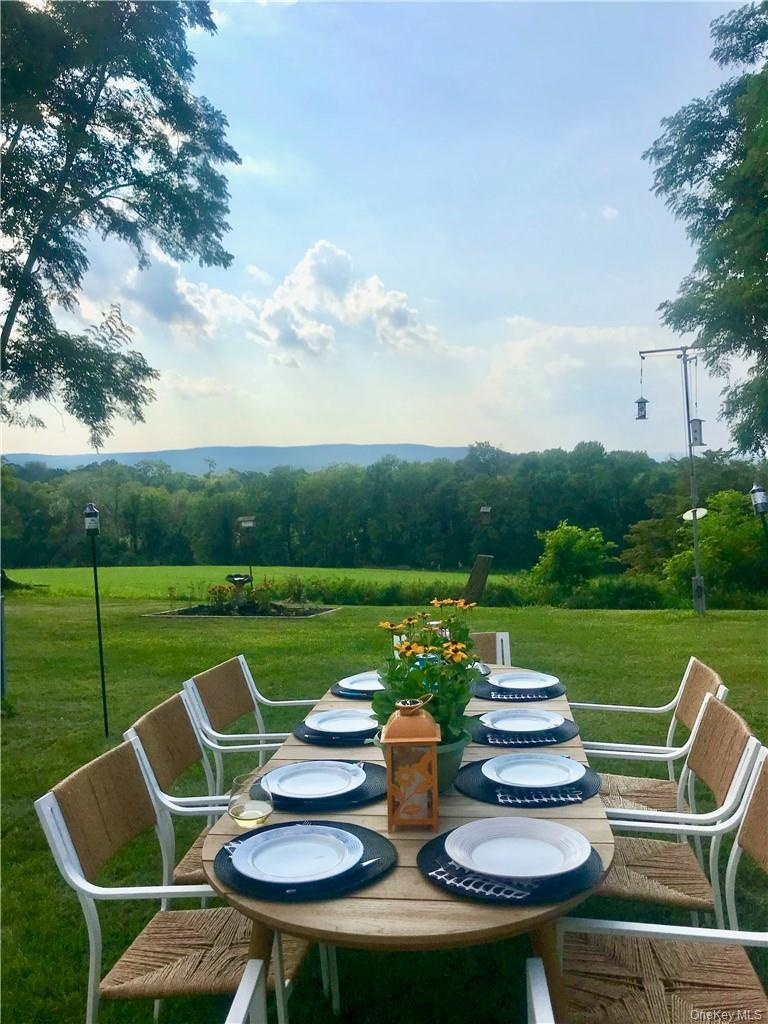 Dine al-fresco in your yard and soak in the incredible views... plenty of room for up to two horses or several mid-size farm animals!